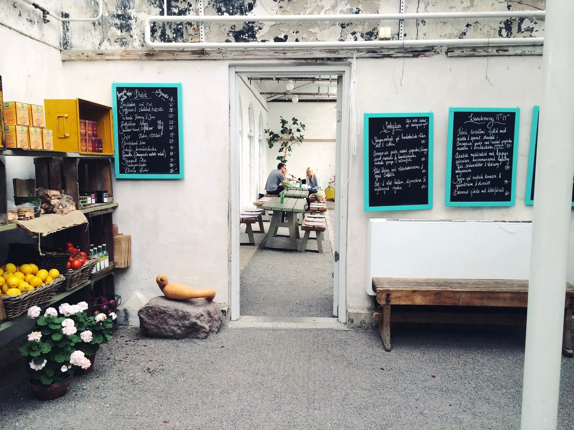 A café wall with the day’s menu written on chalkboards